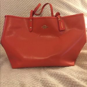 Cute tangerine Coach tote with small bag